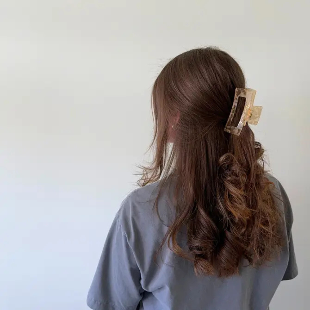 Aven Shimmer Cellulose Acetate Hair Claw Clip in gold-flecked design – eco-friendly, durable, and stylish hair accessory for medium to long hair.