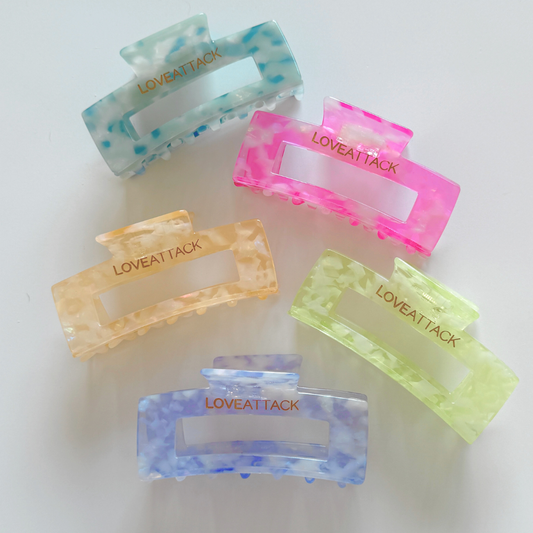 Aven Shimmer Cellulose Acetate Hair Claw Clip in gold-flecked design – eco-friendly, durable, and stylish hair accessory for medium to long hair.
